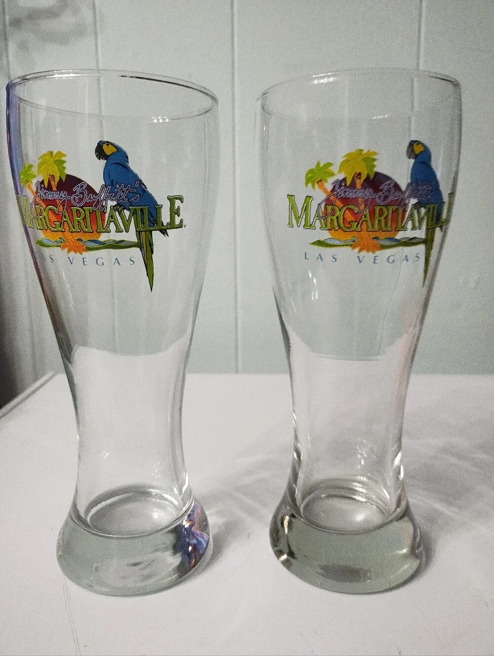 (2) Margaritaville Las Vegas Parrot Pilsner Glasses with Blue & Green Logo